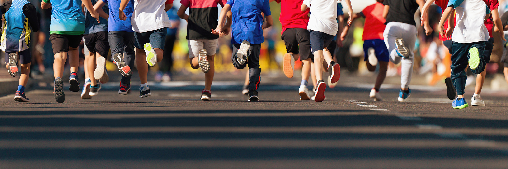 Running children, young athletes run in a kids run race